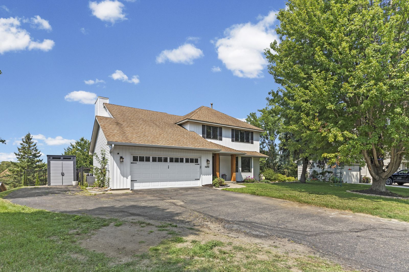 Front exterior of house showing garage and front walkway