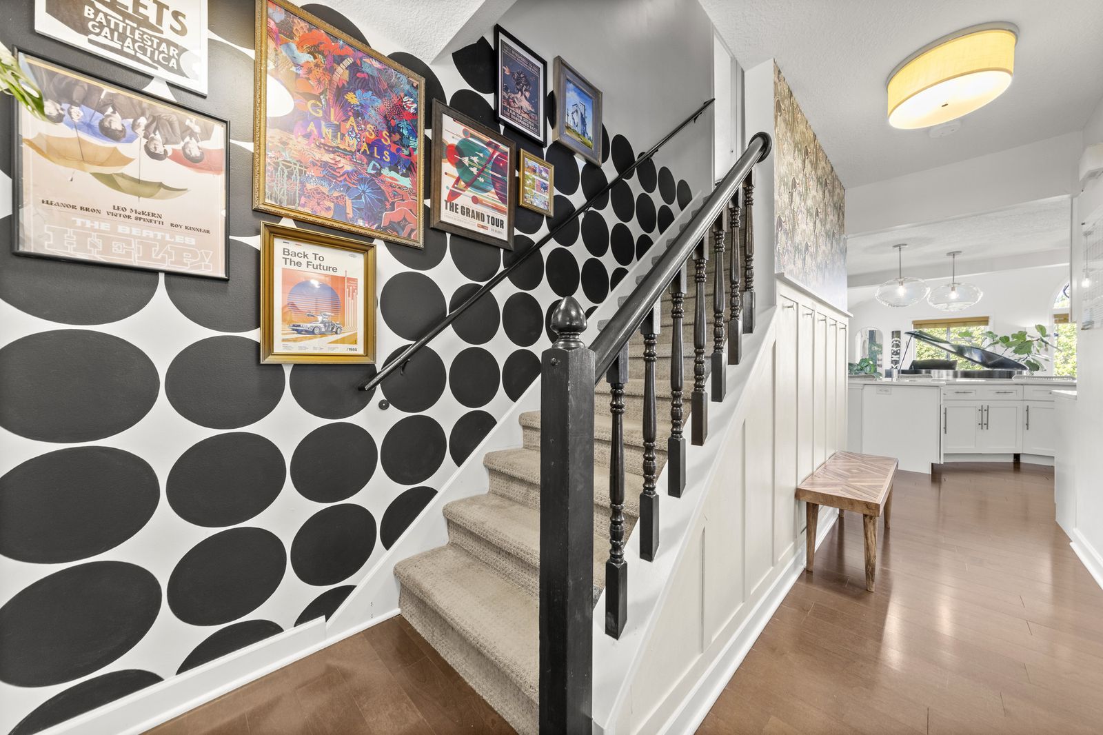Staircase with polka dot wallpaper accent