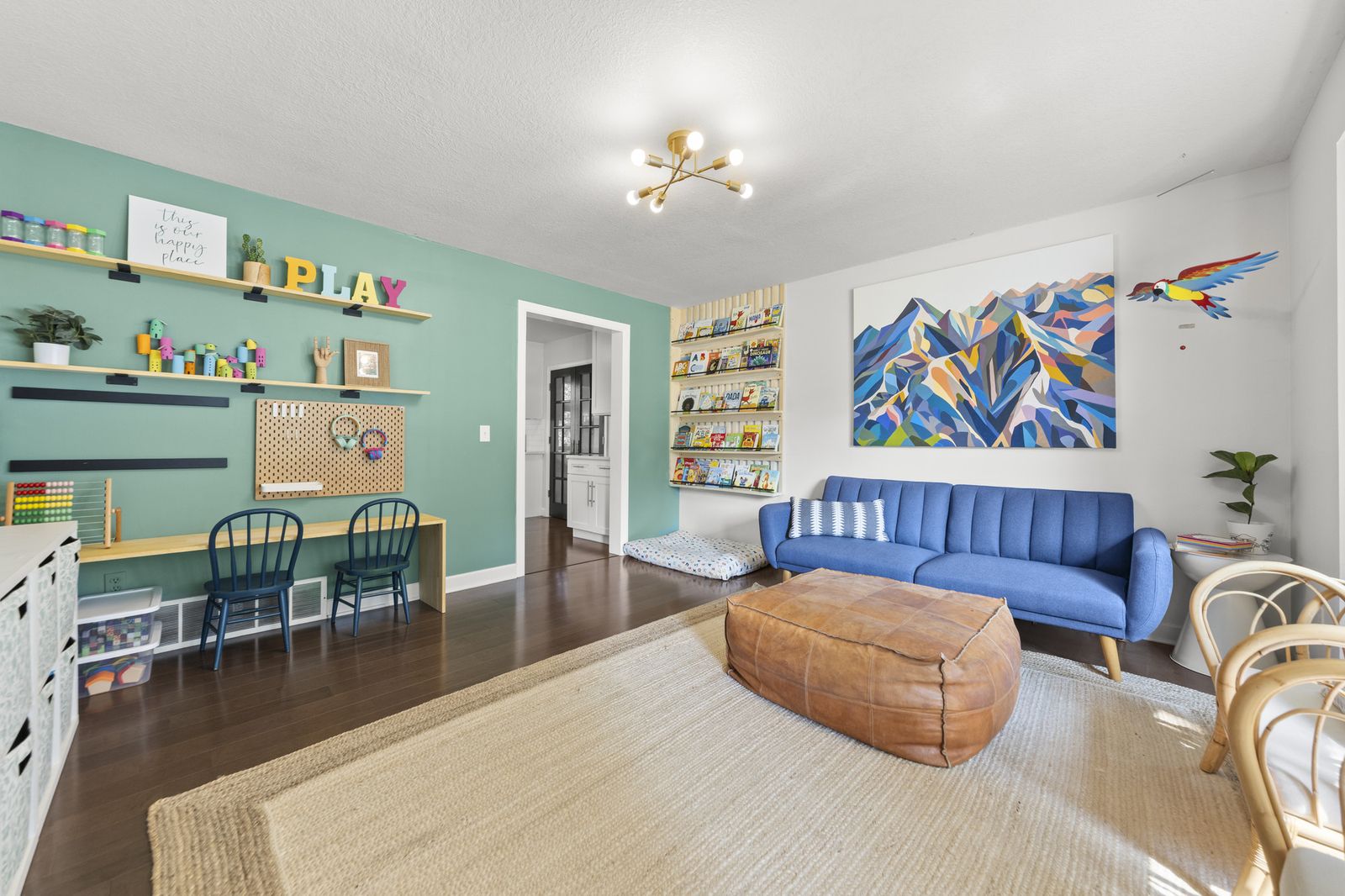 Living room with blue sofa and colorful accents