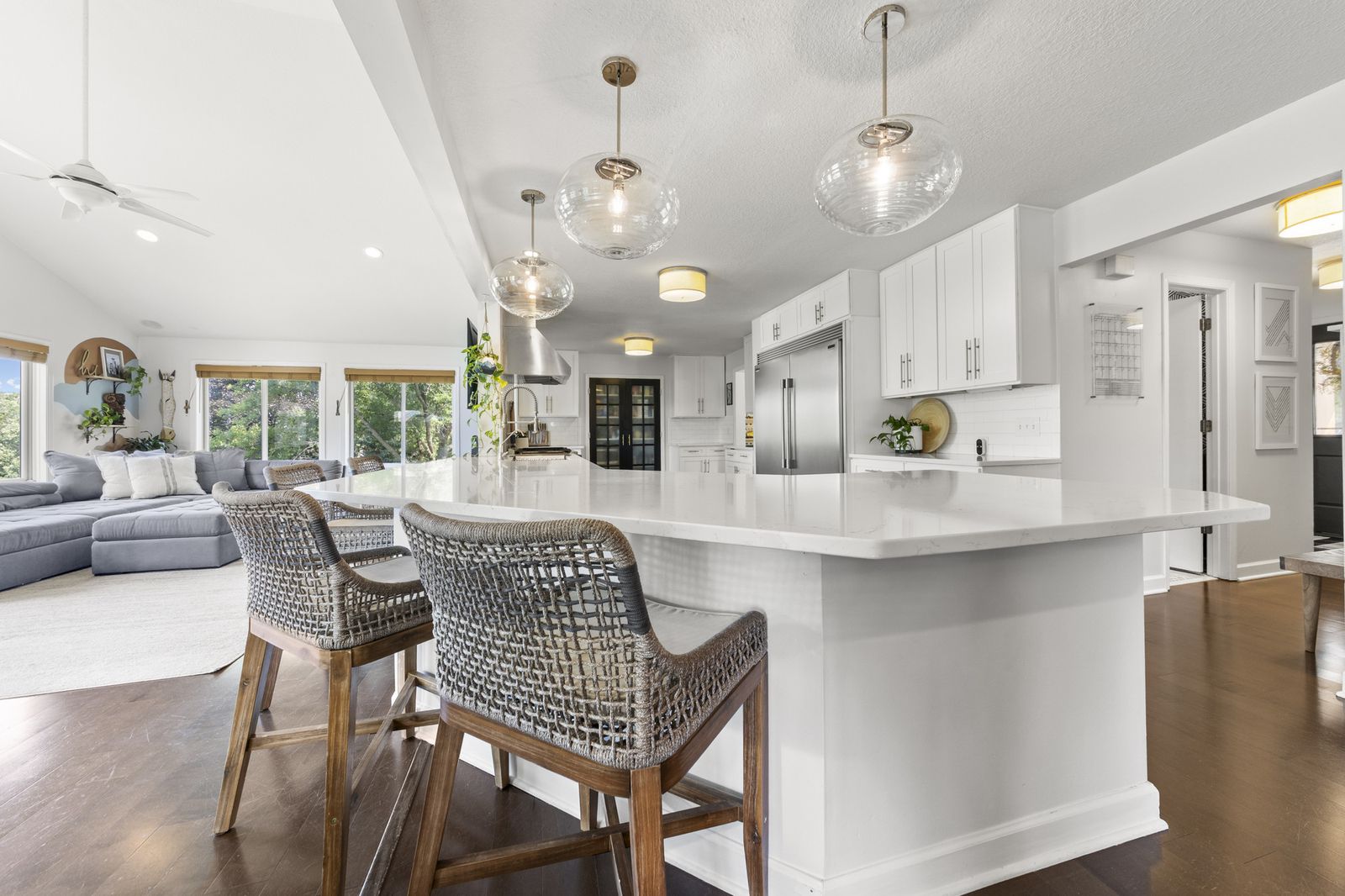 Kitchen with white cabinetry and large island