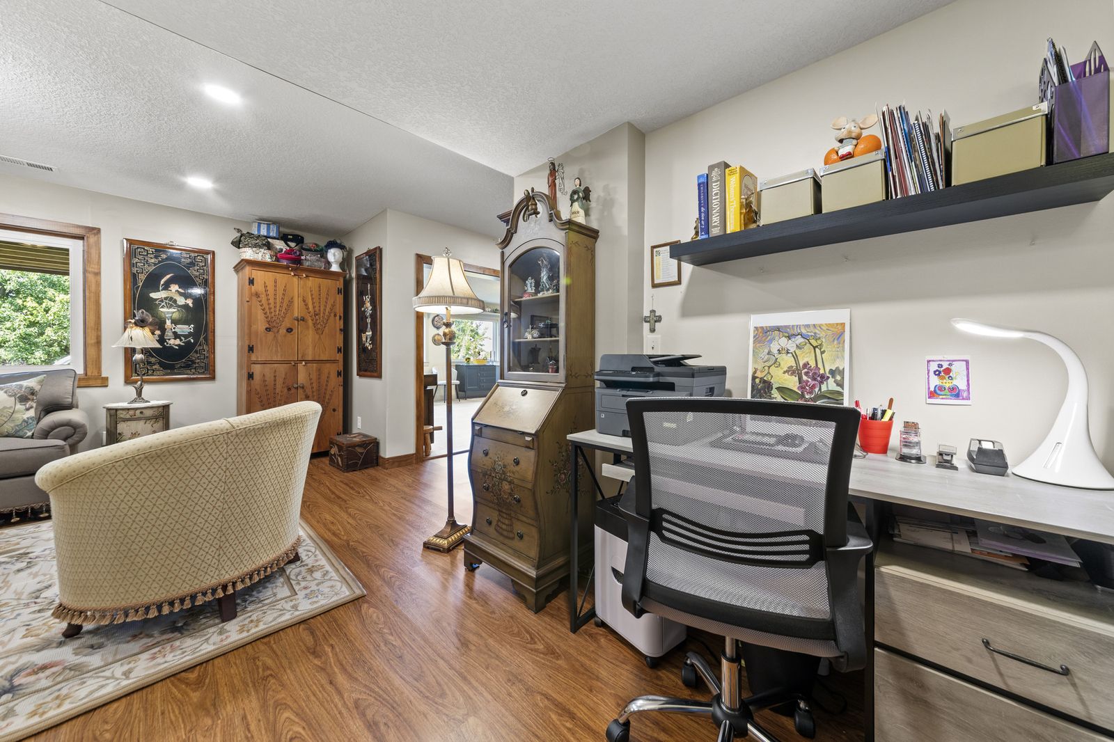 Sitting area with antique furniture and desk