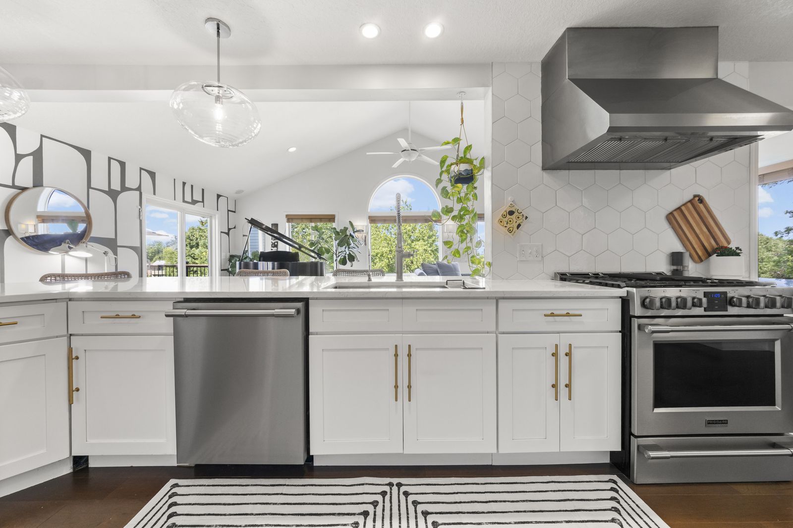 Kitchen with island, pendant lighting, and vaulted ceiling
