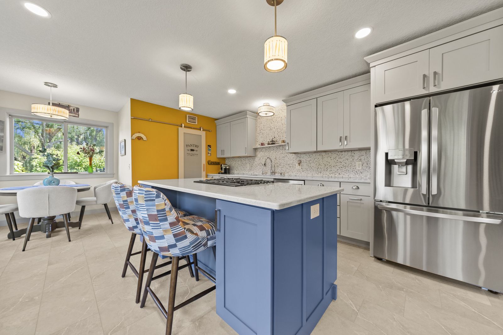 Kitchen island with seating and pendant lighting