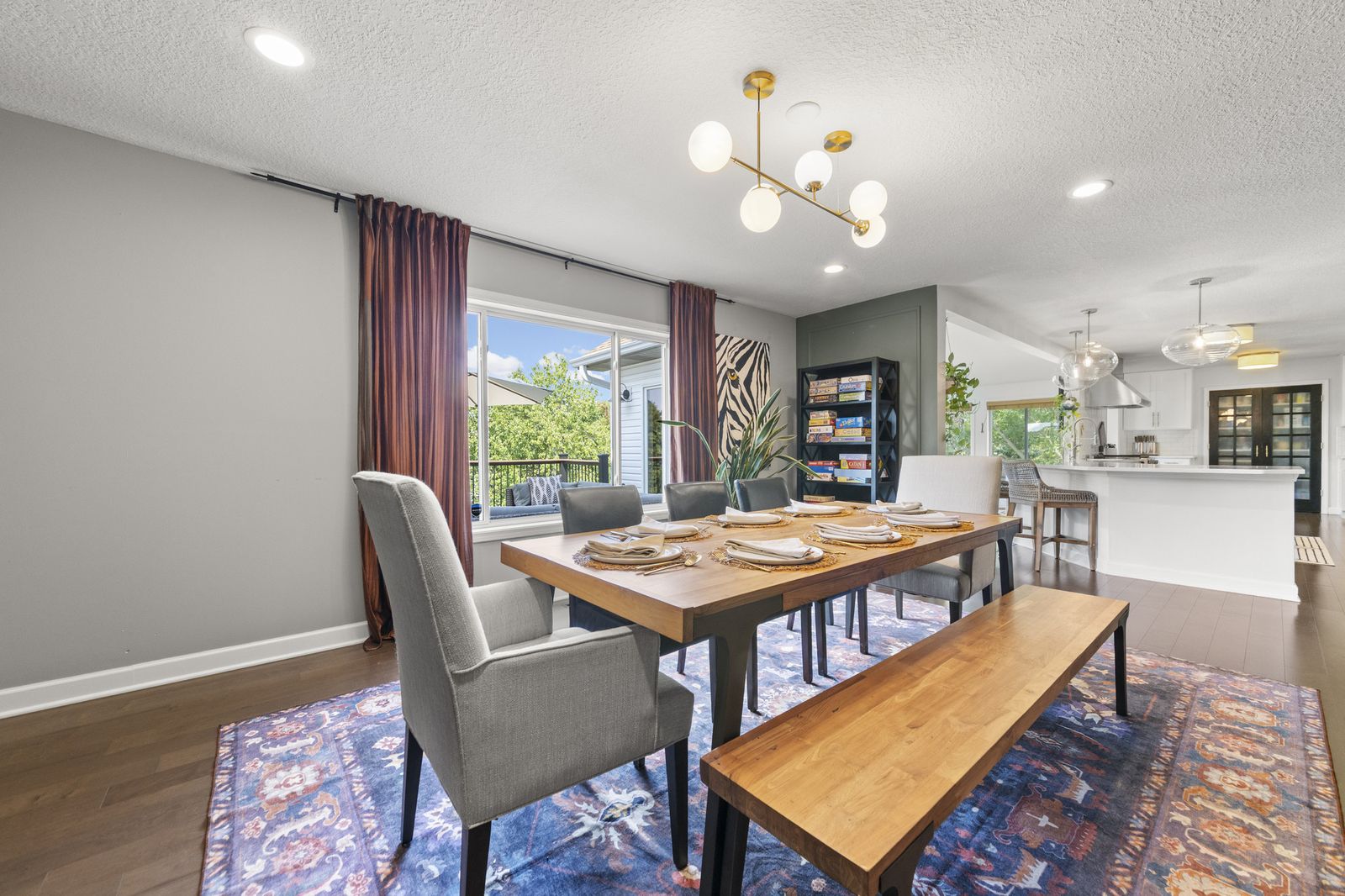 Dining room open to kitchen with natural light