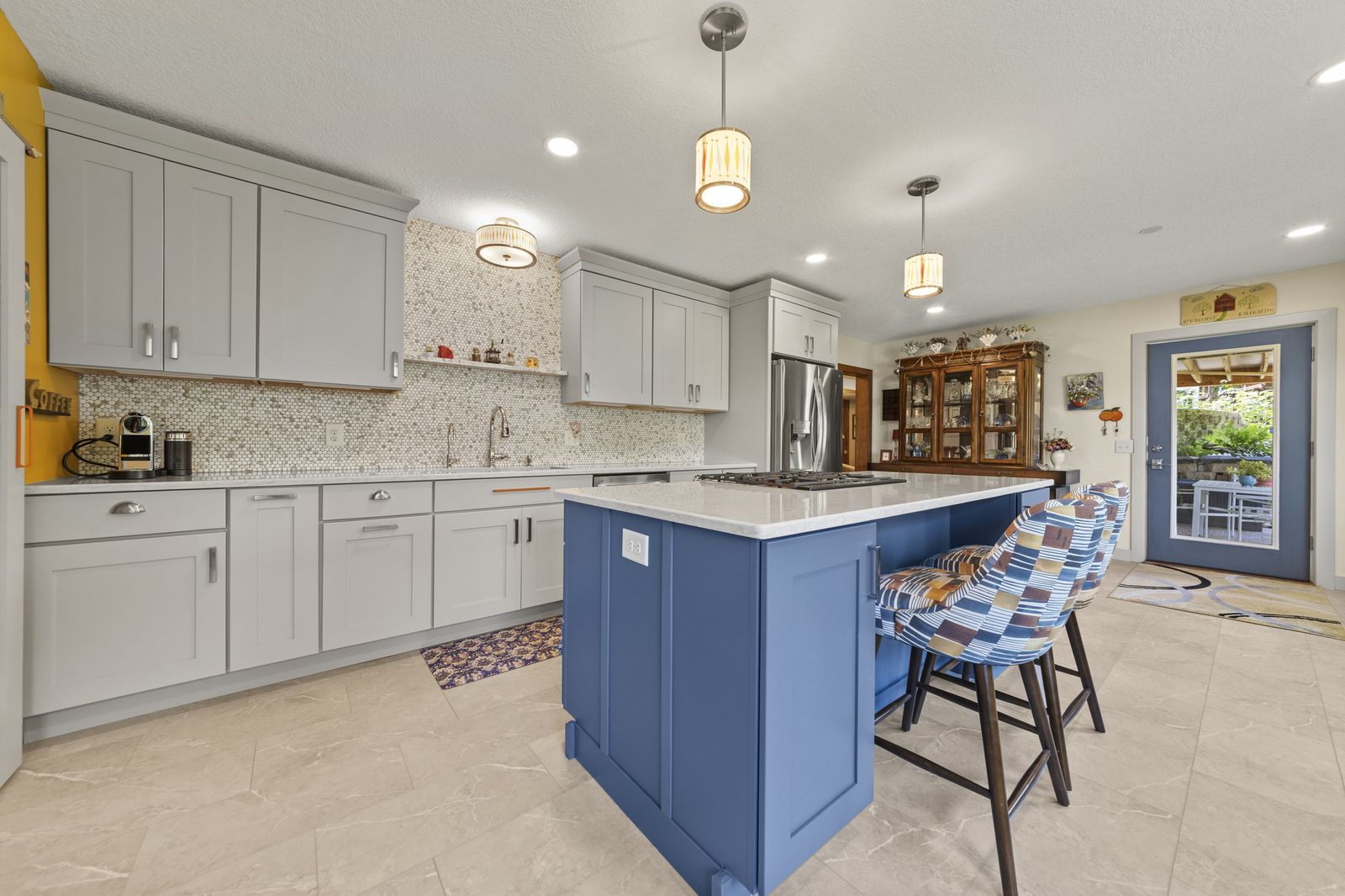 Kitchen with blue island, alternate angle