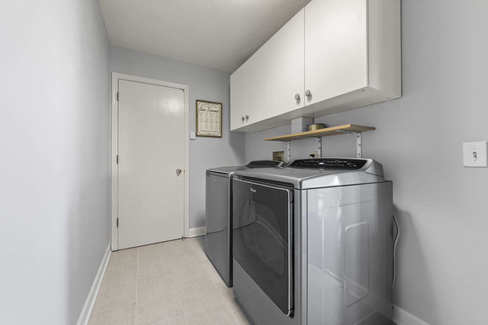 Main level laundry room with washer and dryer