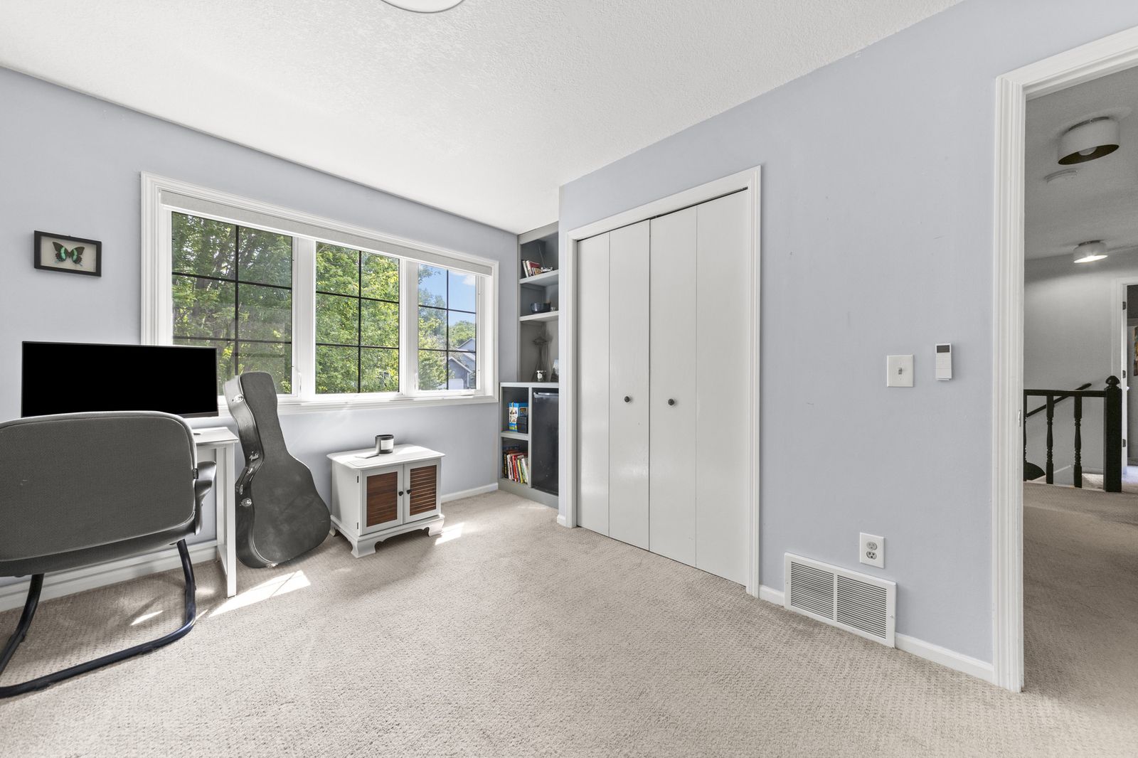 Home office with windows and closet