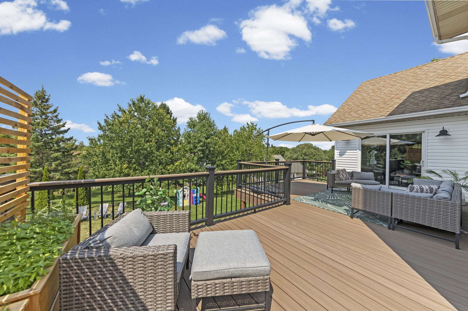 Deck with outdoor seating and umbrella