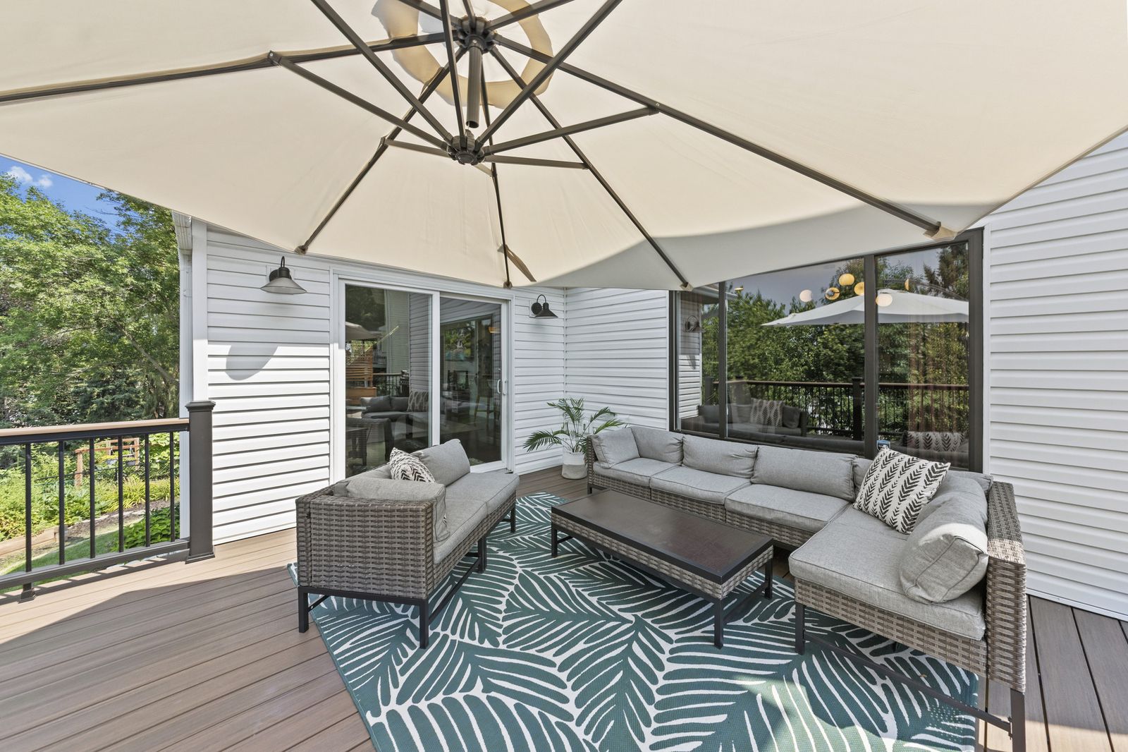 Covered deck with sofa seating and rug