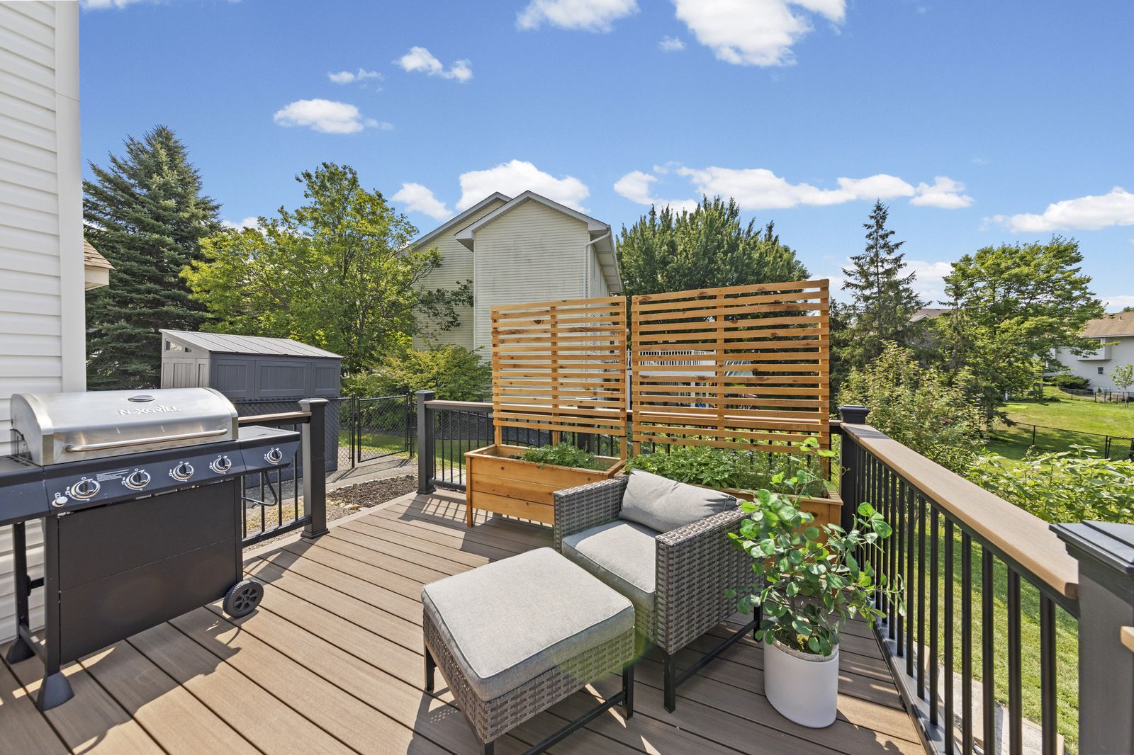 Deck with grill and lounge chairs