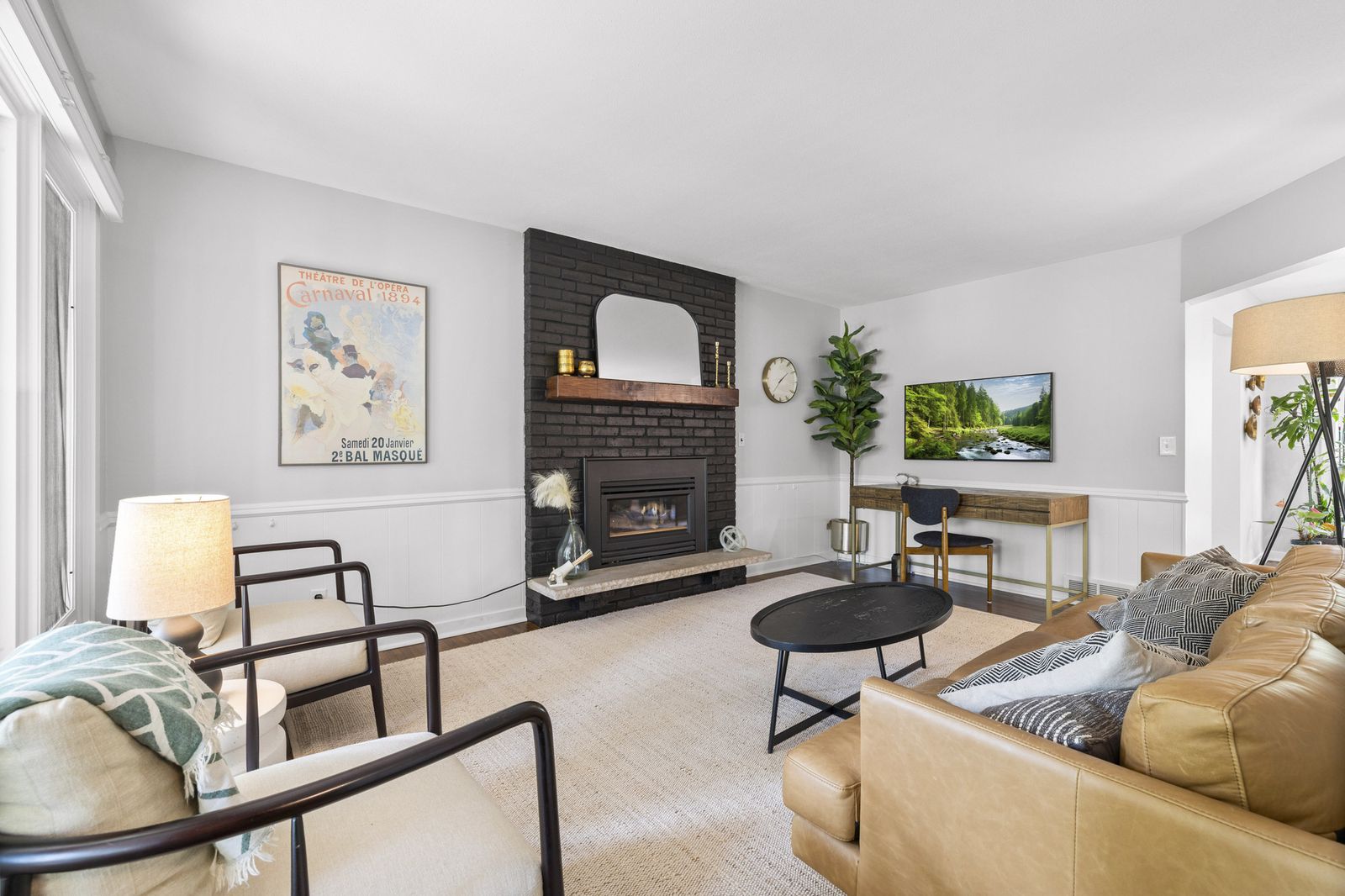 Living room view toward fireplace and seating area