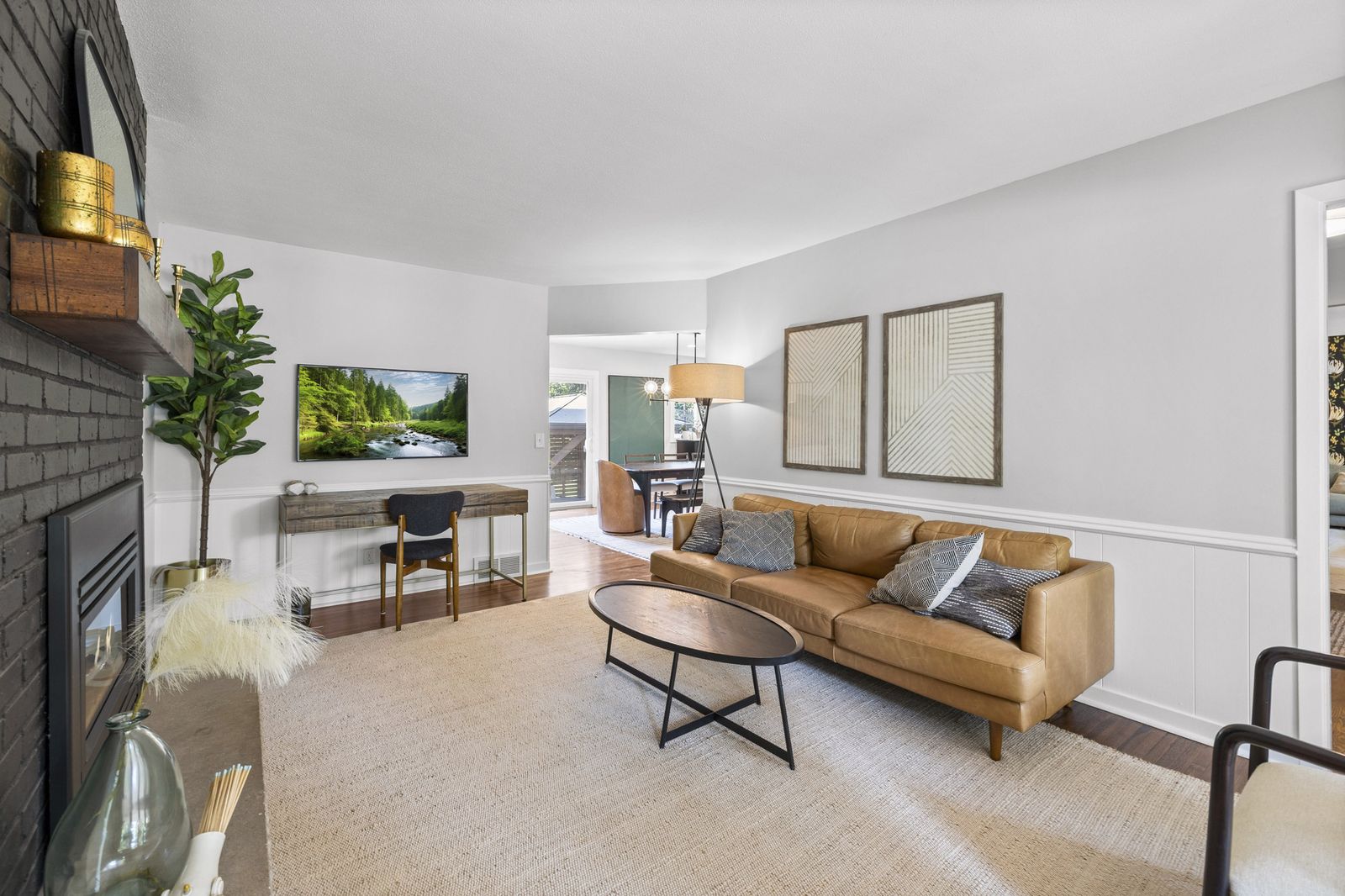 Living room with wall-mounted TV and sofa
