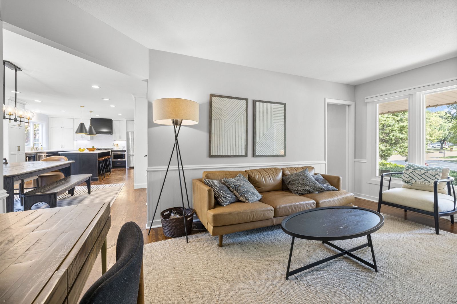 Living room with tan sofa and floor lamp
