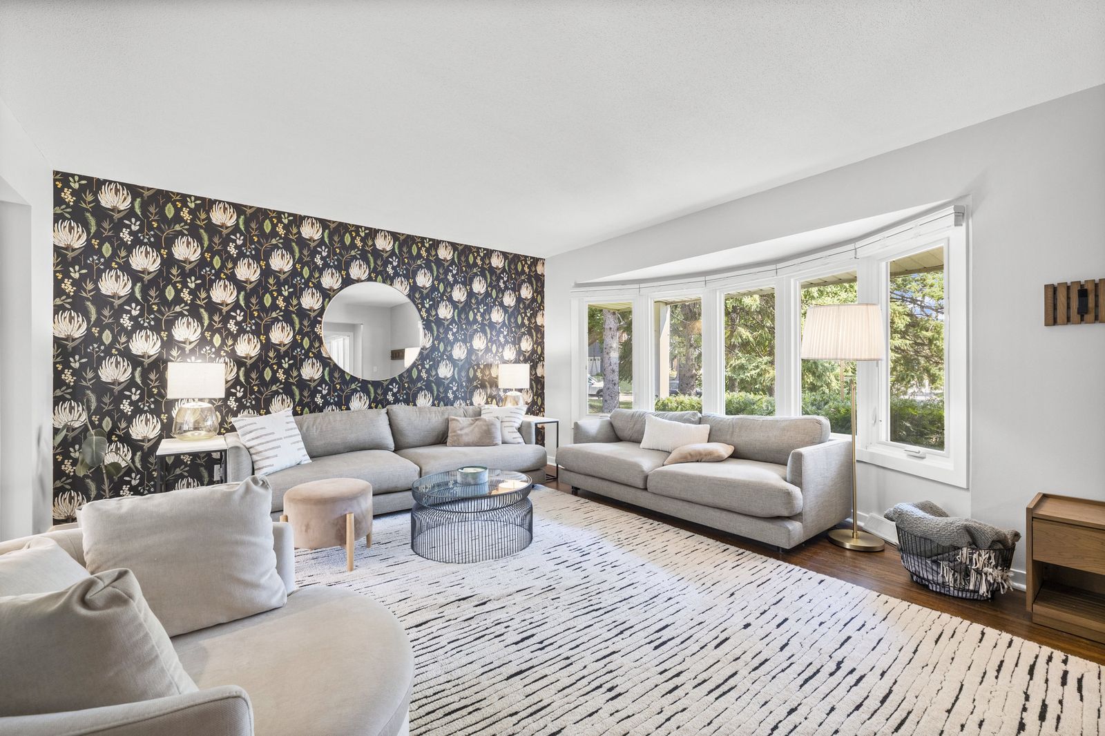 Living room with bay window, virtually staged seating area