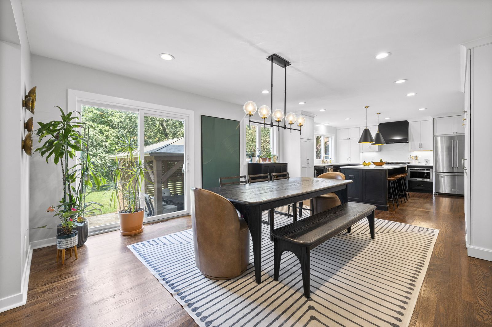 Dining area with dark wood table and bench seating