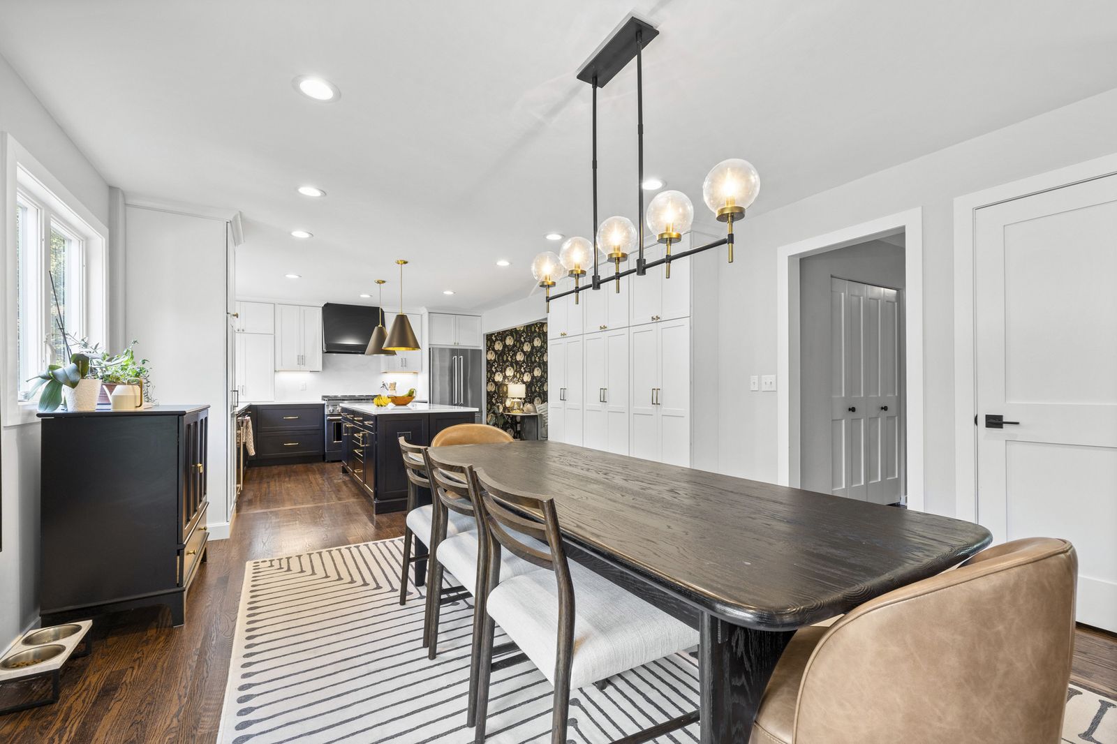 Open dining and kitchen area with pendant lighting
