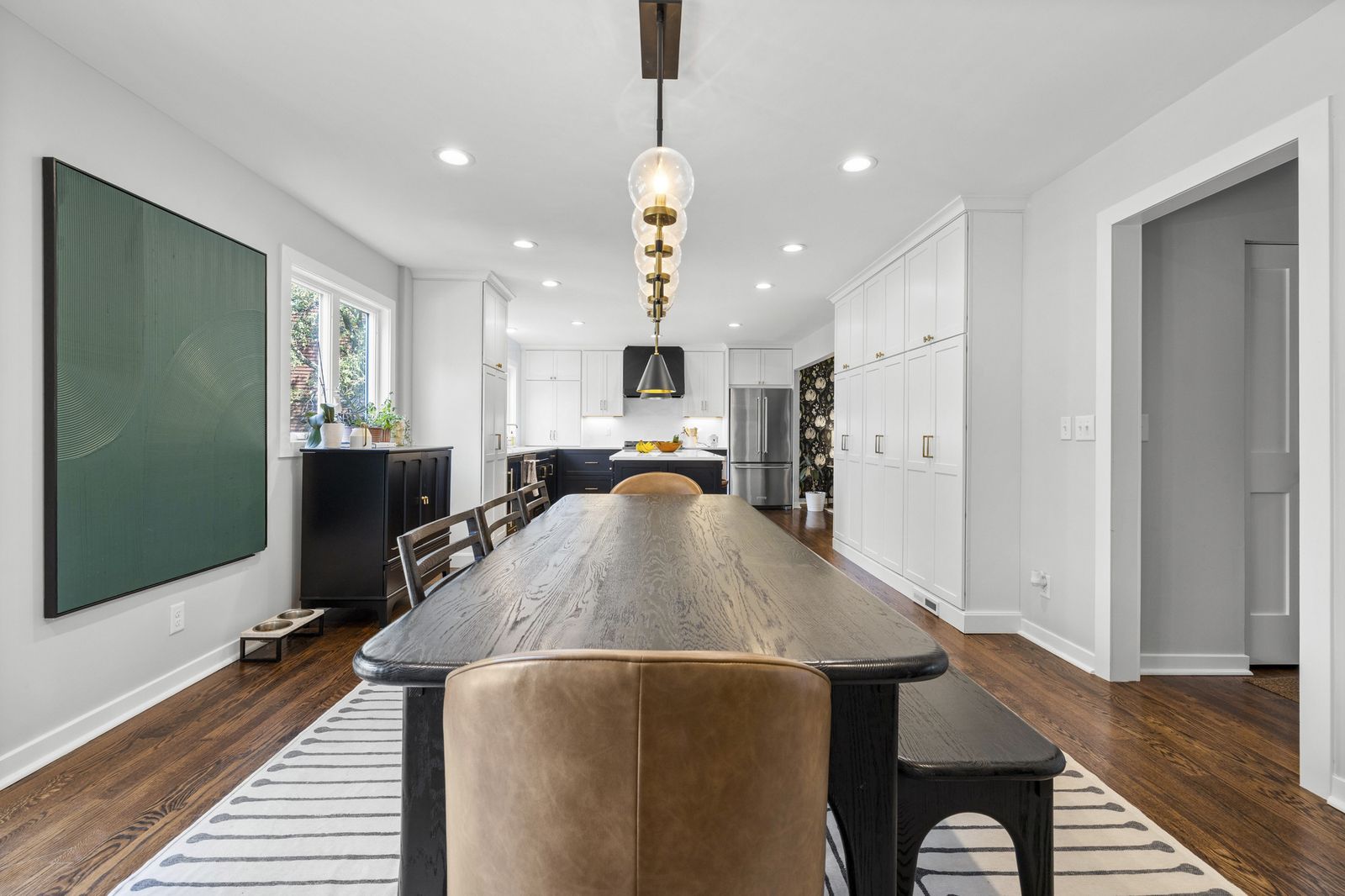 Kitchen island with wood countertop and wine display