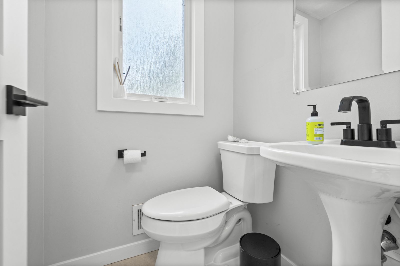 Powder room with pedestal sink and toilet
