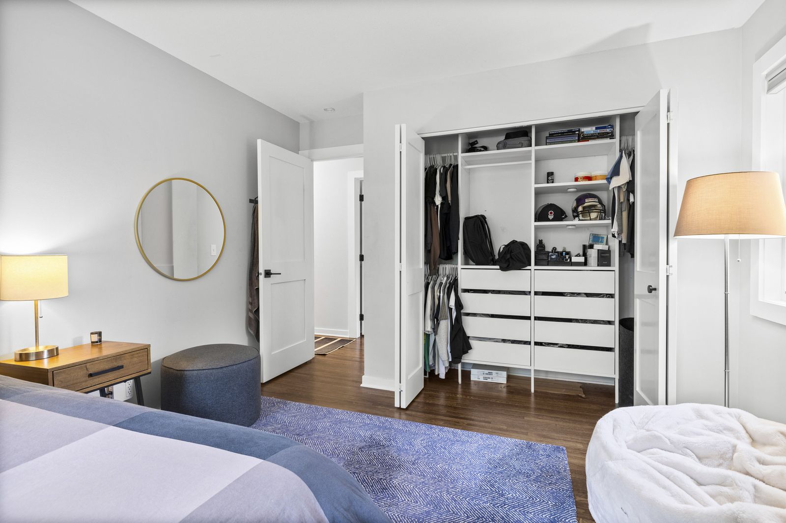 Bedroom with open closet and organizer