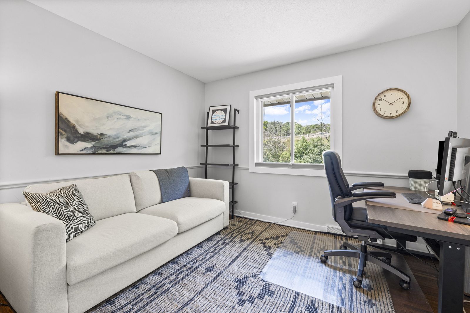 Bonus room with sofa and desk area