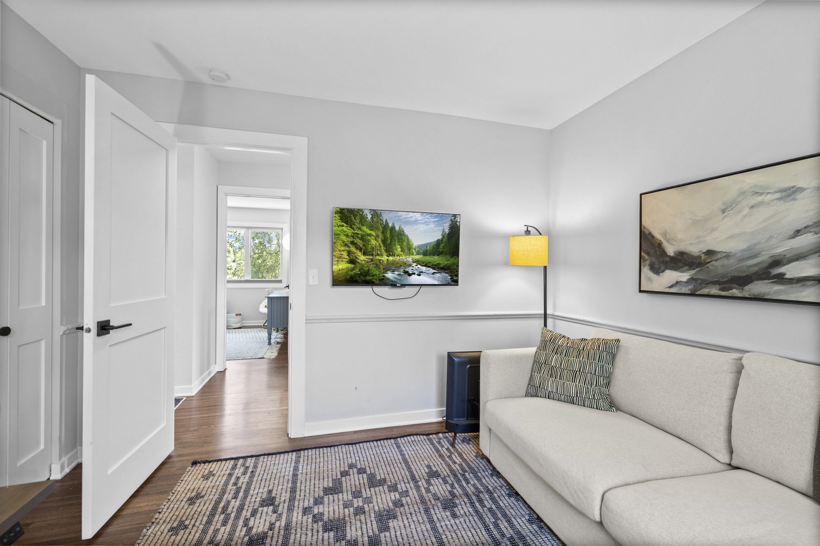 Bonus room with TV and artwork