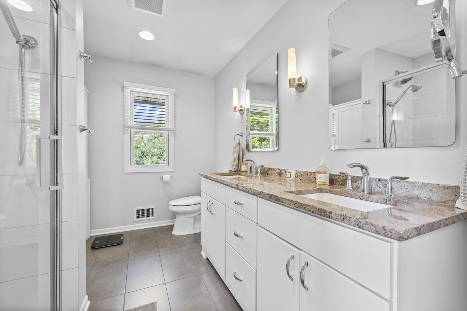 Bathroom with glass shower and vanity