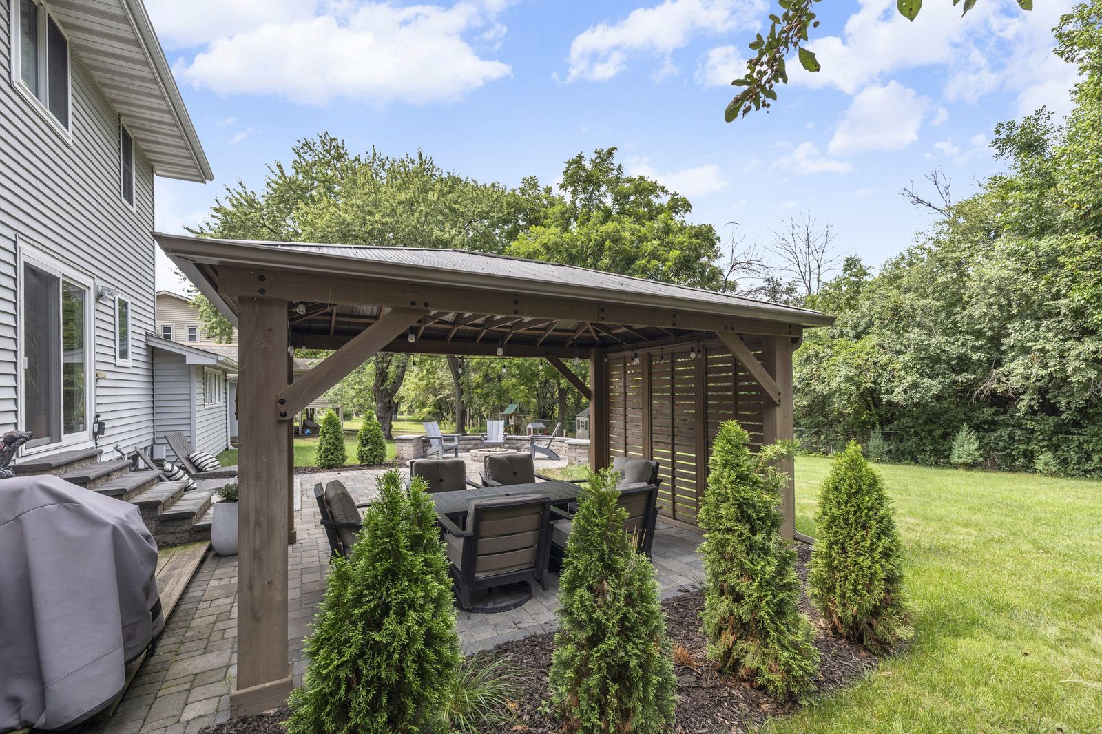 Backyard pergola with outdoor seating area