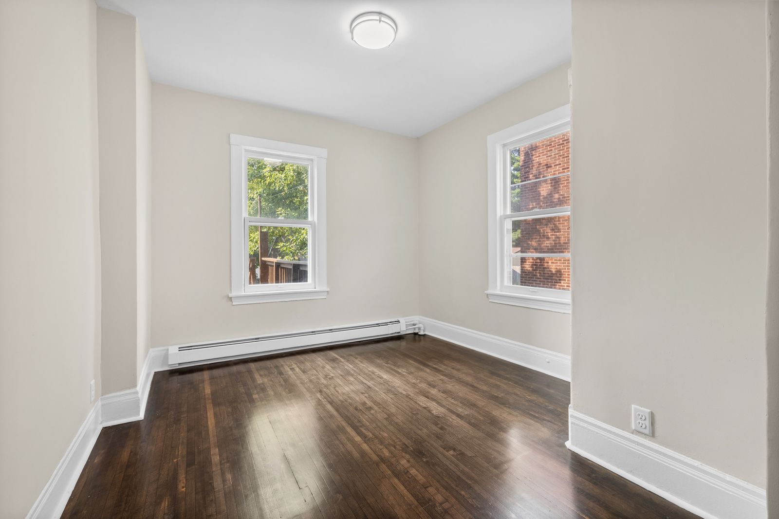 Empty upstairs bedroom with hardwood floors
