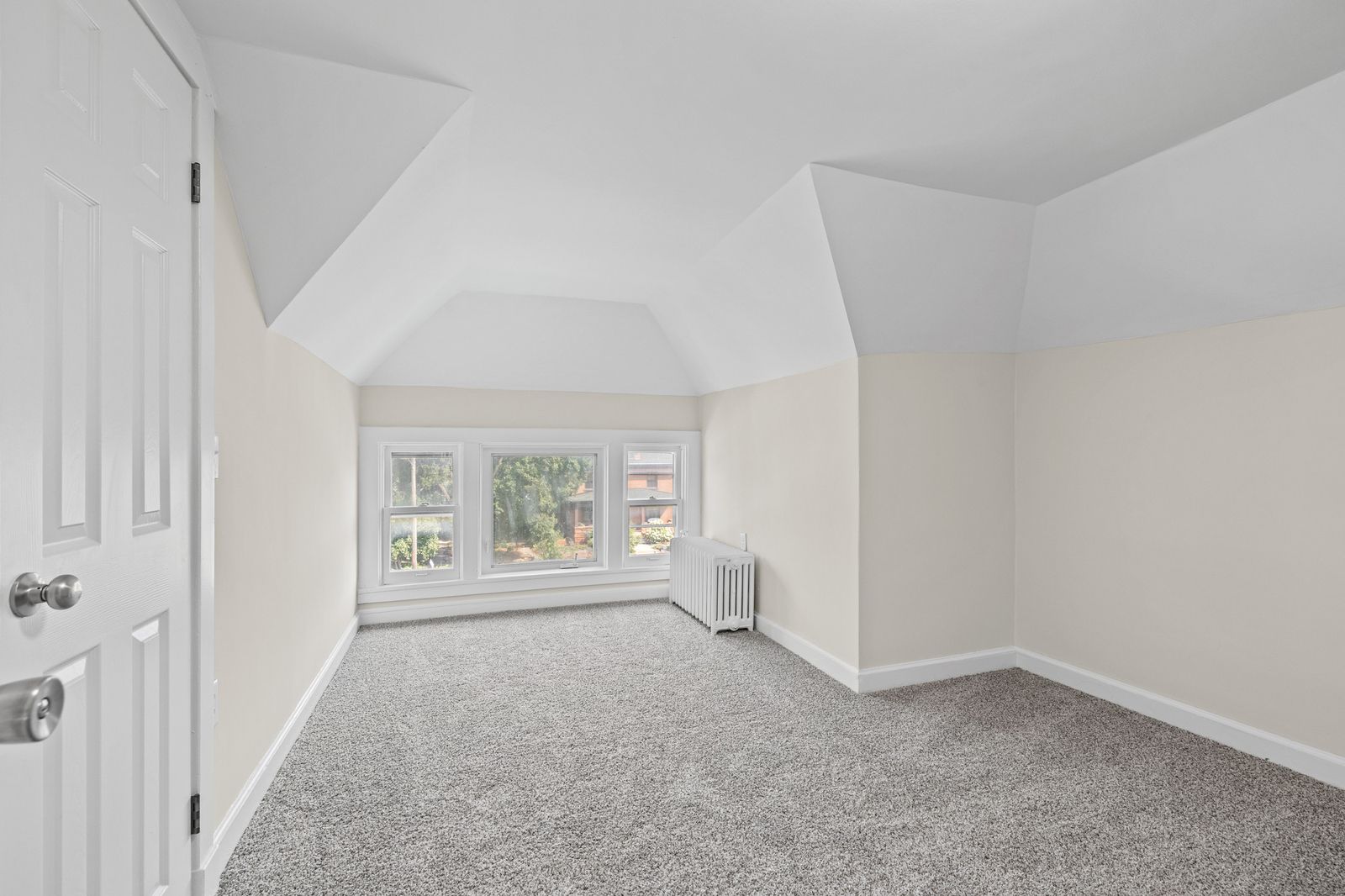 Upstairs bedroom with sloped ceiling