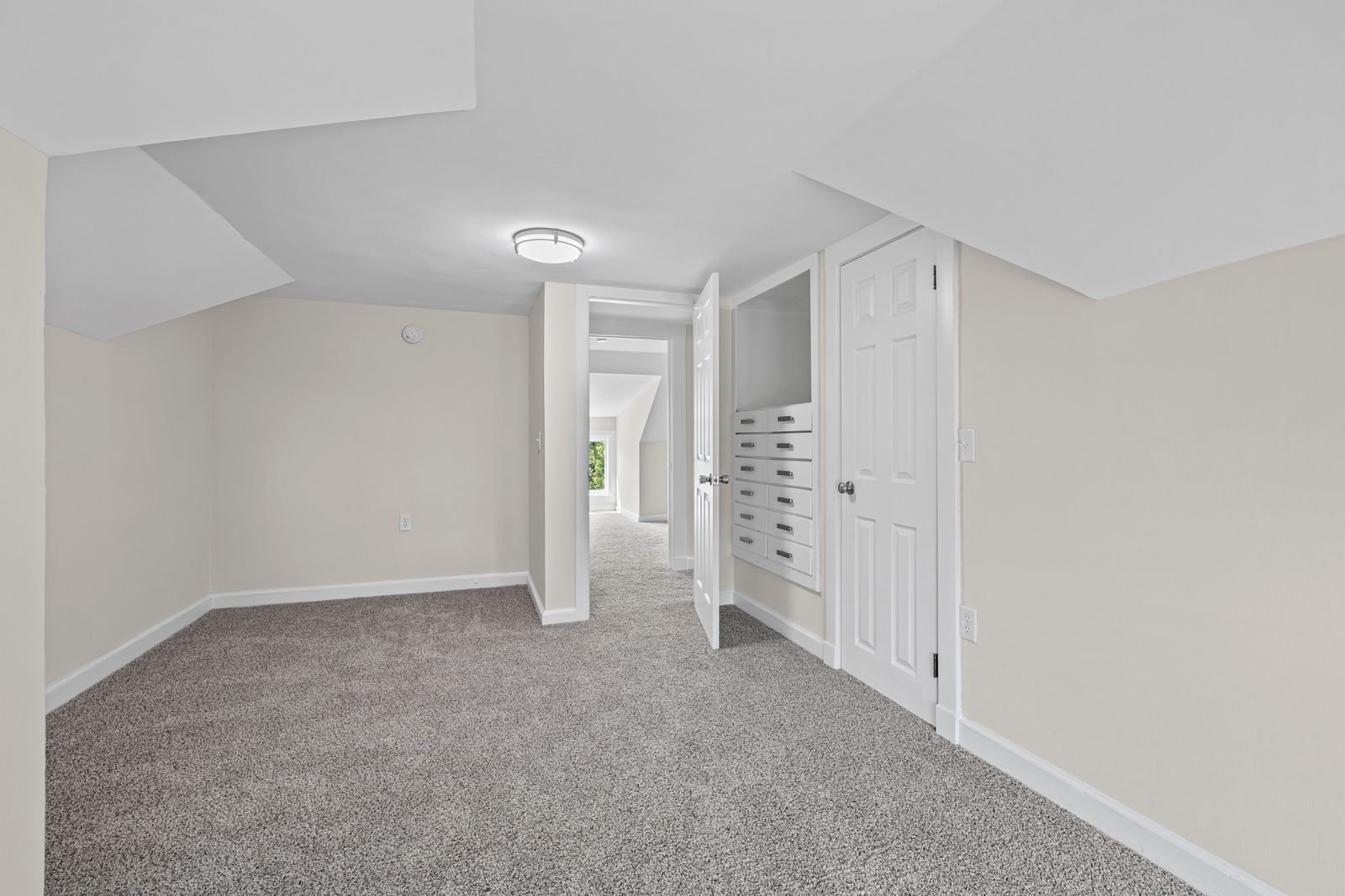 Upstairs hallway with built-in cabinetry