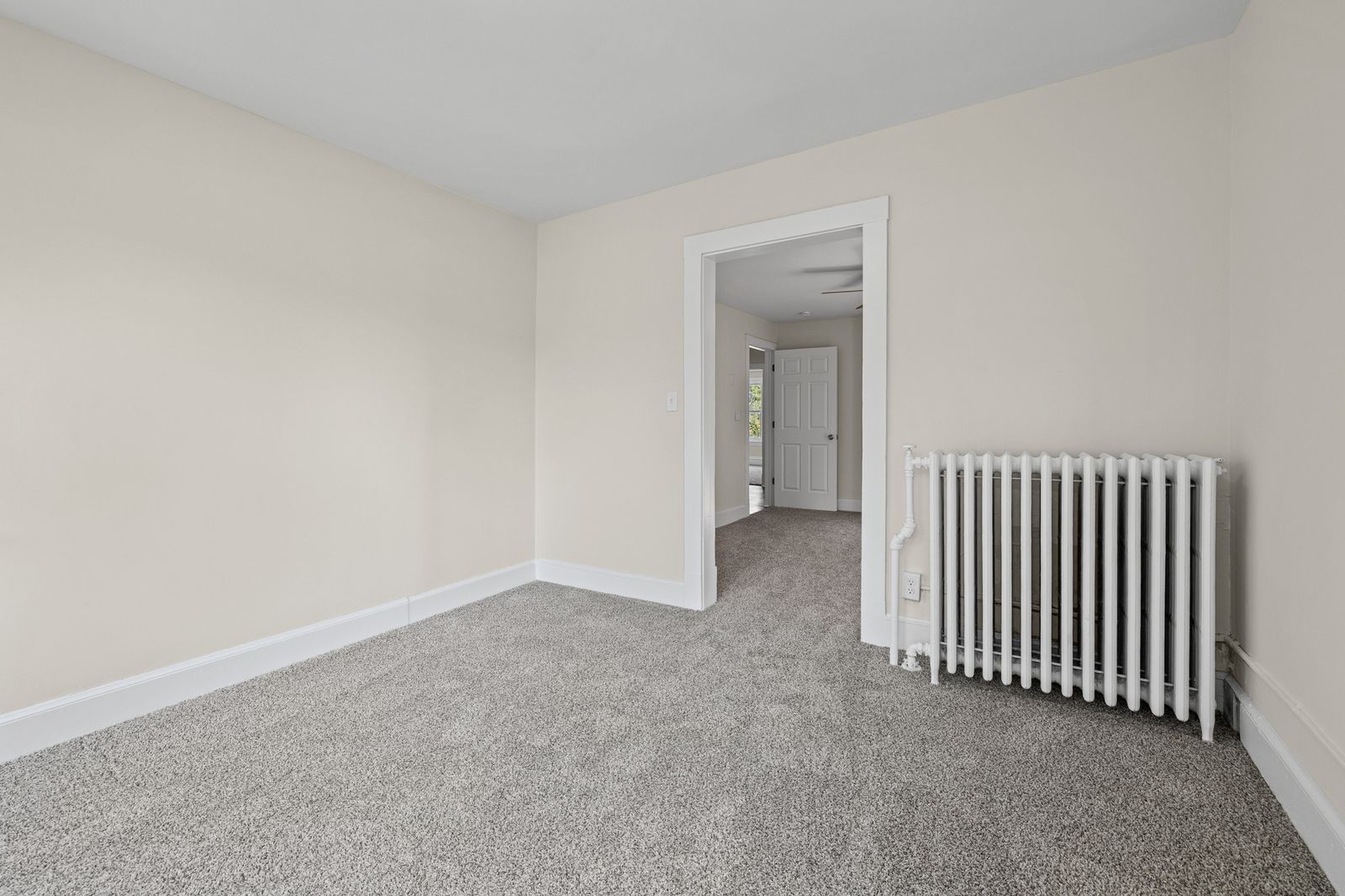 Upstairs bedroom with radiator