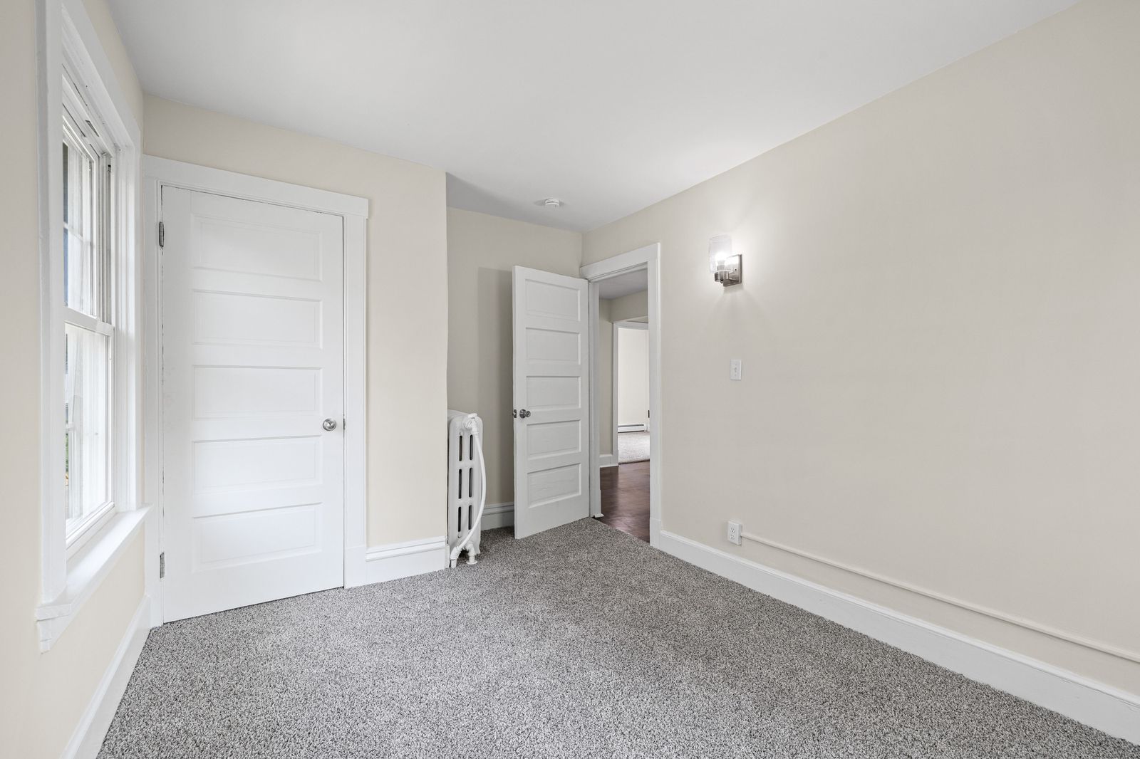 Upstairs bedroom with closet and hallway view