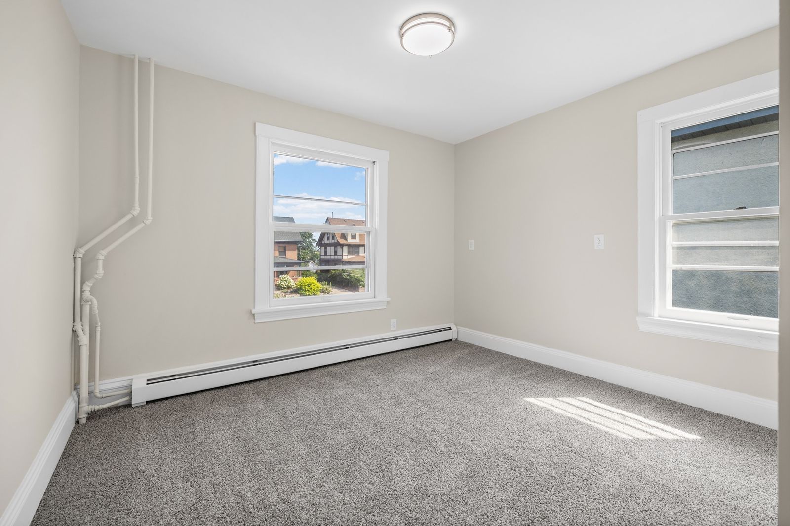 Upstairs bedroom with two windows