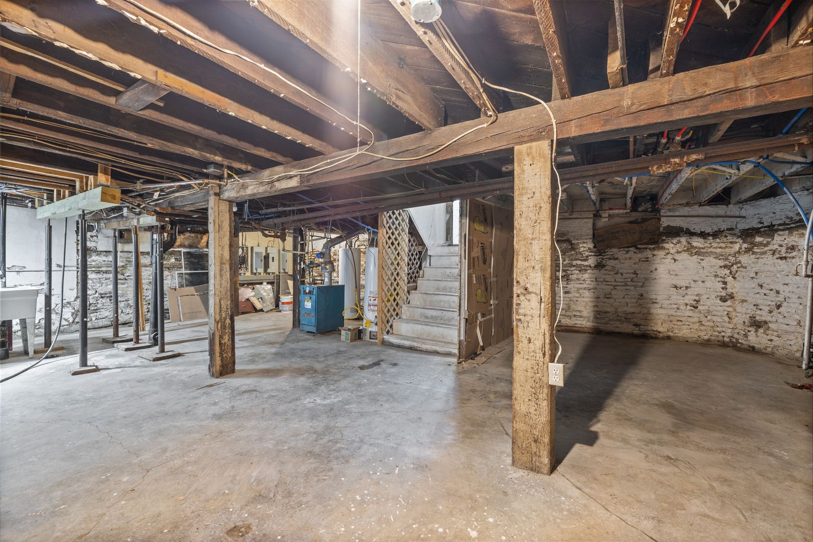 Unfinished basement with exposed beams