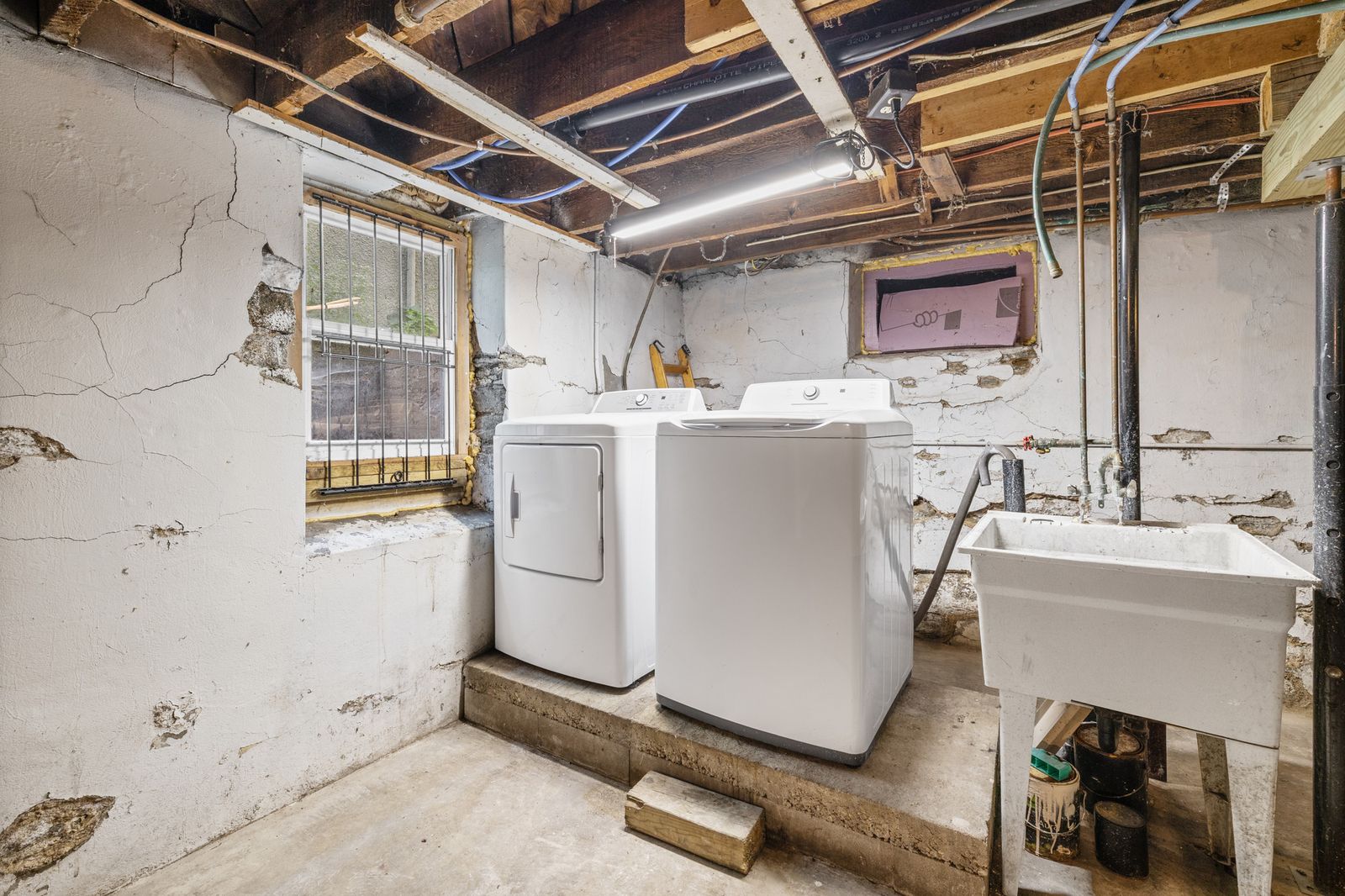 Basement utility area with washer and dryer